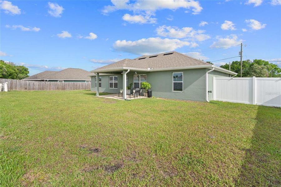 Exterior details and patio area of a home in Orange Blossom Hills, Summerfield (Image 25).