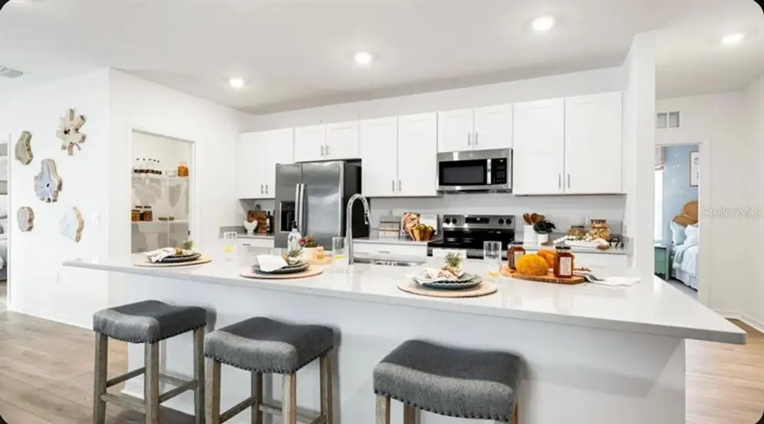 Furnished interior view inside a new home in Waterstone, Groveland (Image 12).