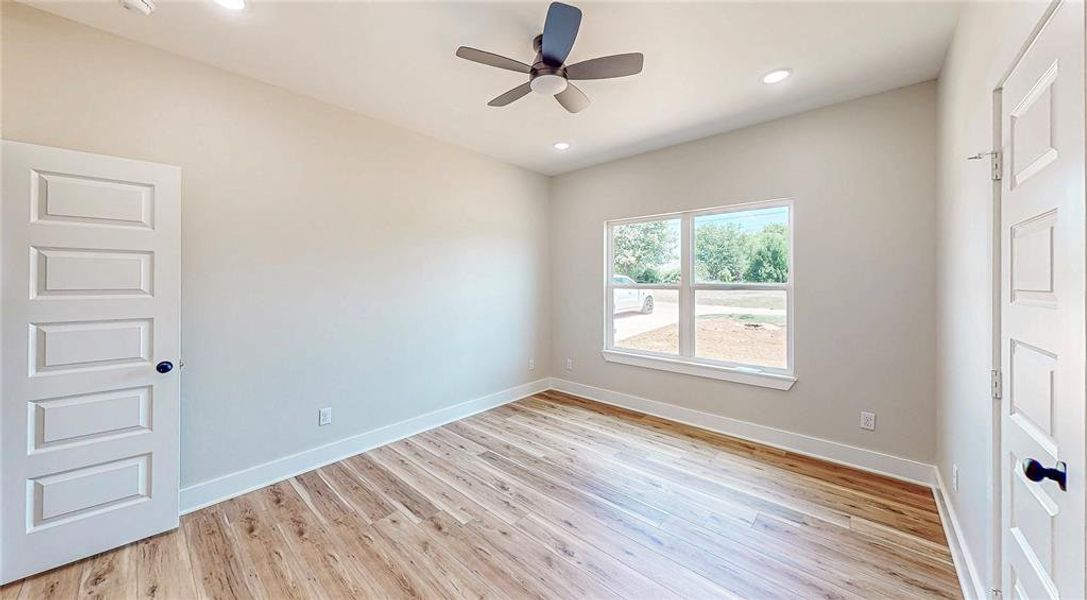 Empty room with light wood-type flooring, ceiling fan, and recessed lighting Empty room with light wood-type flooring, ceiling fan, and recessed lighting
