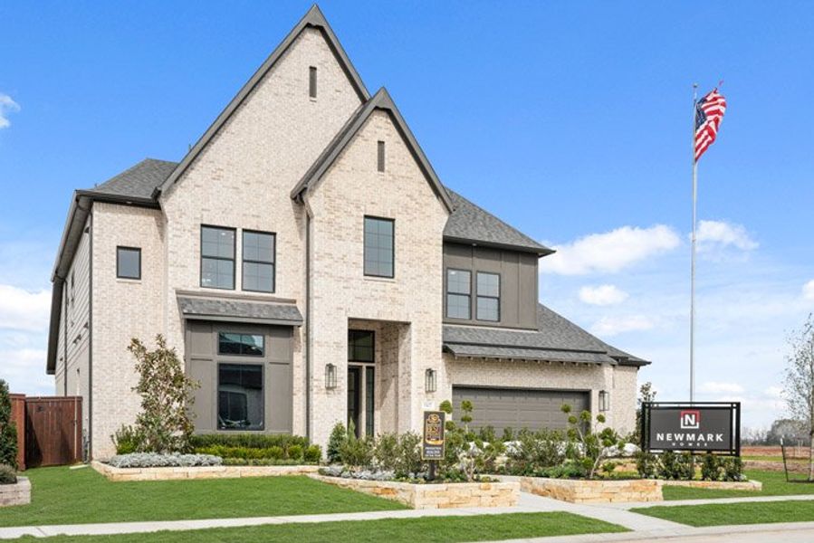 Front exterior of a new home in Meridiana 40', 65', Manvel, TX, highlighting curb appeal (Image 22).