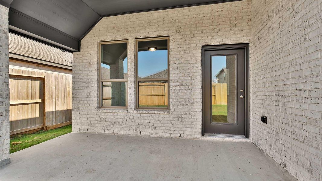 Exterior details and patio area of a home in Candela 40', Richmond (Image 3).