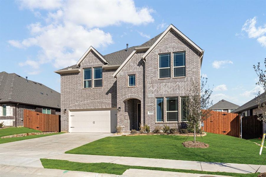 Front exterior of a new home in Country Lakes, Denton, TX, highlighting curb appeal (Image 2).