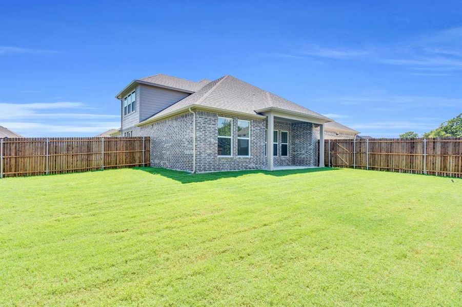 Front exterior of a new home in Ten Mile Creek Estates, DeSoto, TX, highlighting curb appeal (Image 2). Front exterior of a new home in Ten Mile Creek Estates, DeSoto, TX, highlighting curb appeal (Image 2).