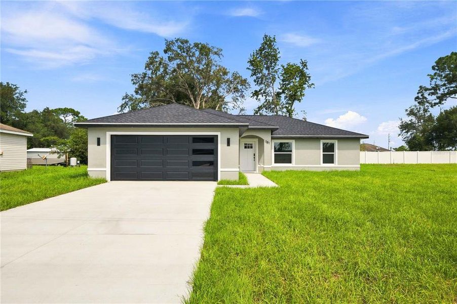 Front exterior of a new home in , Ocala, FL, highlighting curb appeal (Image 1). Front exterior of a new home in , Ocala, FL, highlighting curb appeal (Image 1).