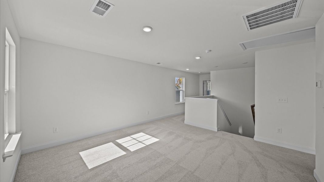 Representative furnished interior of a home built from the Jasmine by DRB Homes in Essex Village, Franklinton (Image 18).