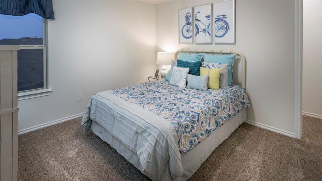 Bedroom featuring dark carpet