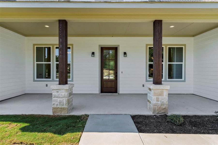 Front exterior of a new home in , Granbury, TX, highlighting curb appeal (Image 23). Front exterior of a new home in , Granbury, TX, highlighting curb appeal (Image 23).