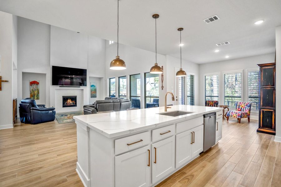 This spacious, open-concept layout is well-lit with natural light that seamlessly connects the heart of the home as one.