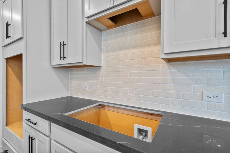 A close up detail of this city inspired brick backsplash. A close up detail of this city inspired brick backsplash.