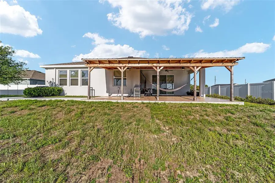 Exterior details and patio area of a home in Brookhaven, Ocala (Image 4).