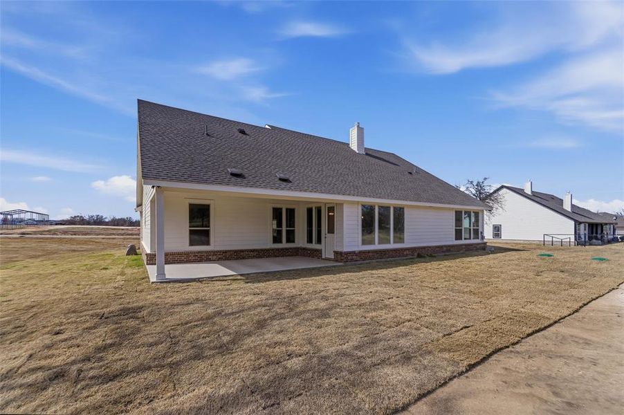 Exterior details and patio area of a home in Oak Grove Addition, Springtown (Image 19).