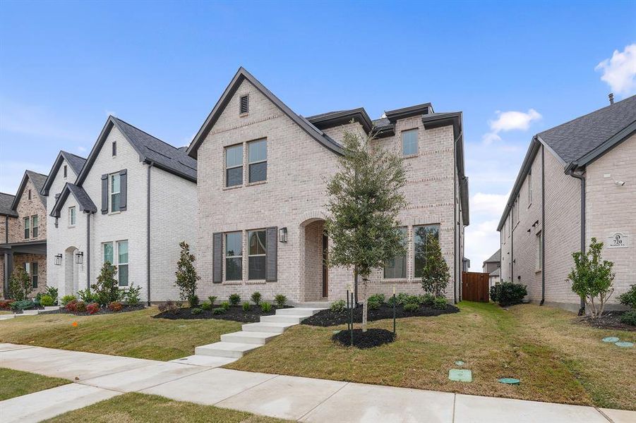 Front exterior of a new home in Light Farms Brenham - 40' Lots, Celina, TX, highlighting curb appeal (Image 2).