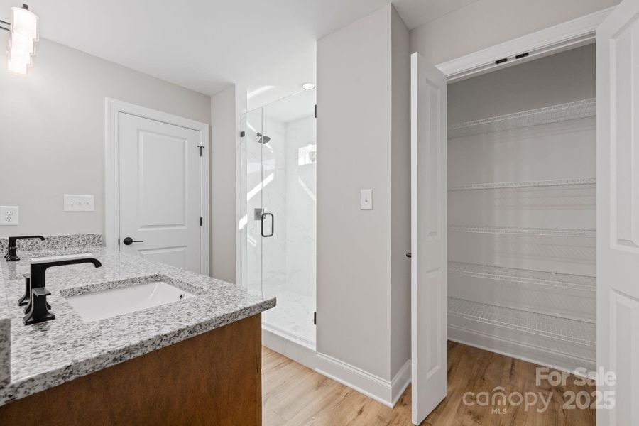 Thoughtfully designed Primary bathroom layout with a large walk-in shower, and a dedicated linen closet for added storage. Thoughtfully designed Primary bathroom layout with a large walk-in shower, and a dedicated linen closet for added storage.
