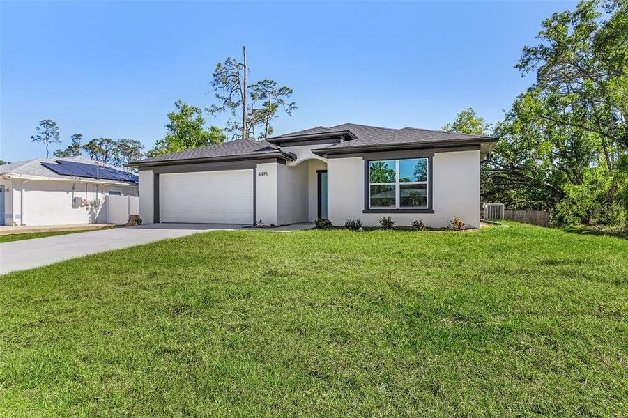 Front exterior of a new home in , North Port, FL, highlighting curb appeal (Image 13).