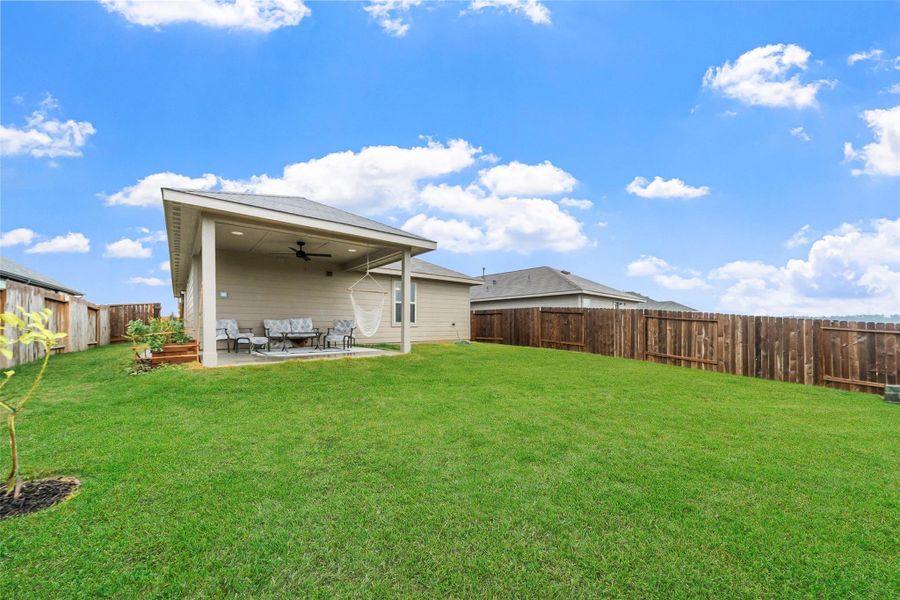 Exterior details and patio area of a home in Magnolia Ridge: Cottage Collection, Magnolia (Image 3).