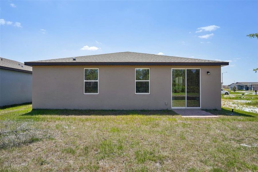 Exterior details and patio area of a home in Lake Deer Estates - Signature Series, Poinciana (Image 24). Exterior details and patio area of a home in Lake Deer Estates - Signature Series, Poinciana (Image 24).