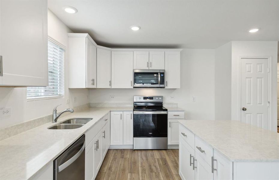 Bright kitchen with ample cabinet space *real home pictured