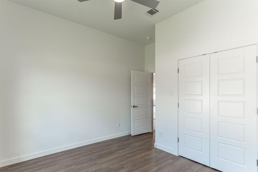 Secondary bedroom with large double door closet