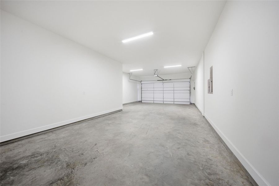 Expansive oversized 3-car garage offering ample space for vehicles, storage, workshop potential, and everyday convenience.