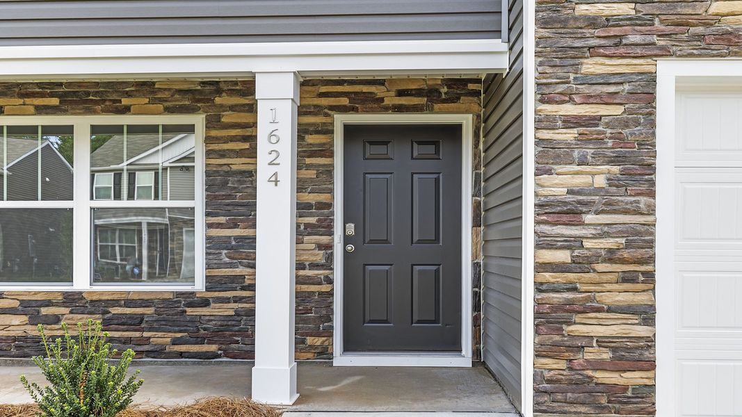 Front exterior of a new home in Lightwood Cottages, Moore, SC, highlighting curb appeal (Image 18).