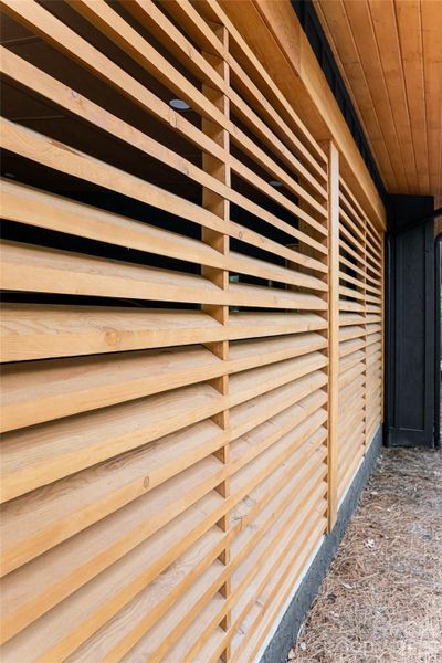 Beautiful wood louvers encase the carport