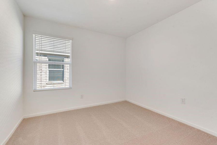 Unfurnished room with carpet