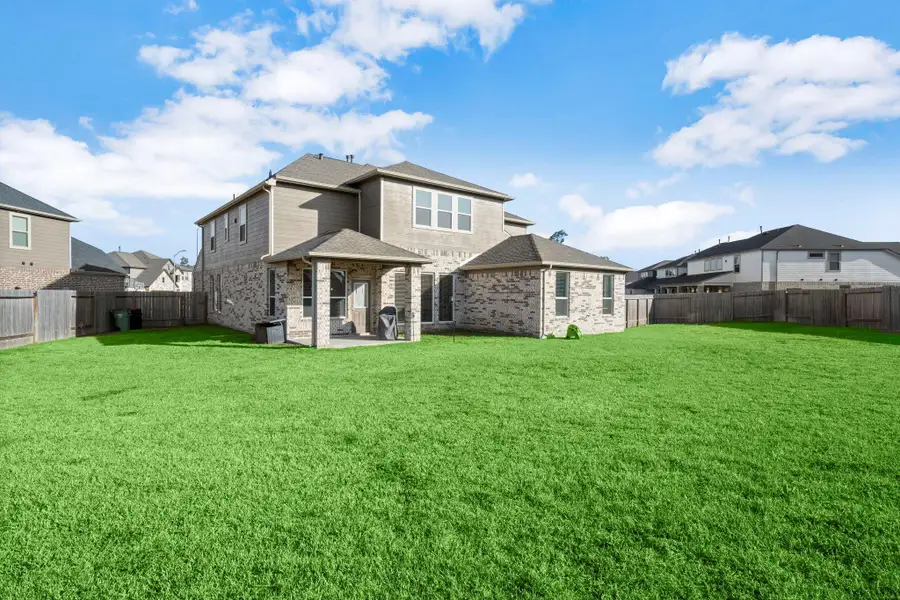 Exterior details and patio area of a home in Bradbury Forest, Spring (Image 24).