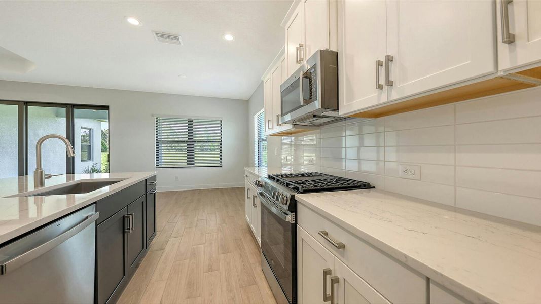 Furnished interior view inside a new home in Palm Grove Real Estate and Homes for Sale in Lakewood Ranch, FL - Neal Communities, Lakewood Ranch (Image 12).