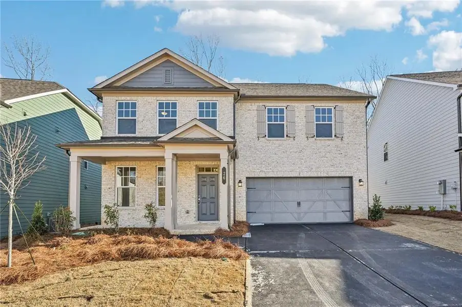 Front exterior of a new home in Creekside, Dawsonville, GA, highlighting curb appeal (Image 1). Front exterior of a new home in Creekside, Dawsonville, GA, highlighting curb appeal (Image 1).