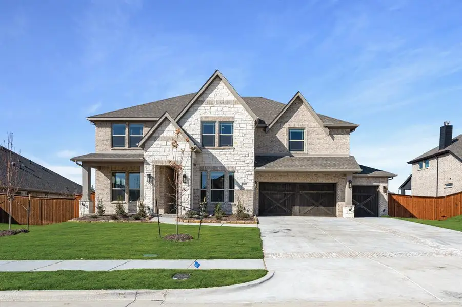 Front exterior of a new home in Hayes Crossing, Midlothian, TX, highlighting curb appeal (Image 1). Front exterior of a new home in Hayes Crossing, Midlothian, TX, highlighting curb appeal (Image 1).