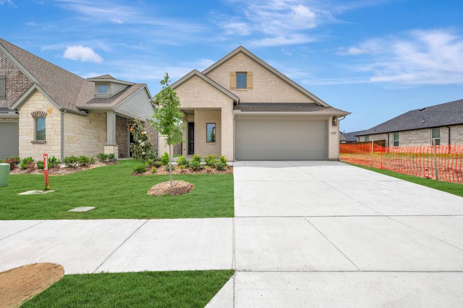 Front exterior of a new home in Creekshaw – Gardens, Royse City, TX, highlighting curb appeal (Image 1). Front exterior of a new home in Creekshaw – Gardens, Royse City, TX, highlighting curb appeal (Image 1).