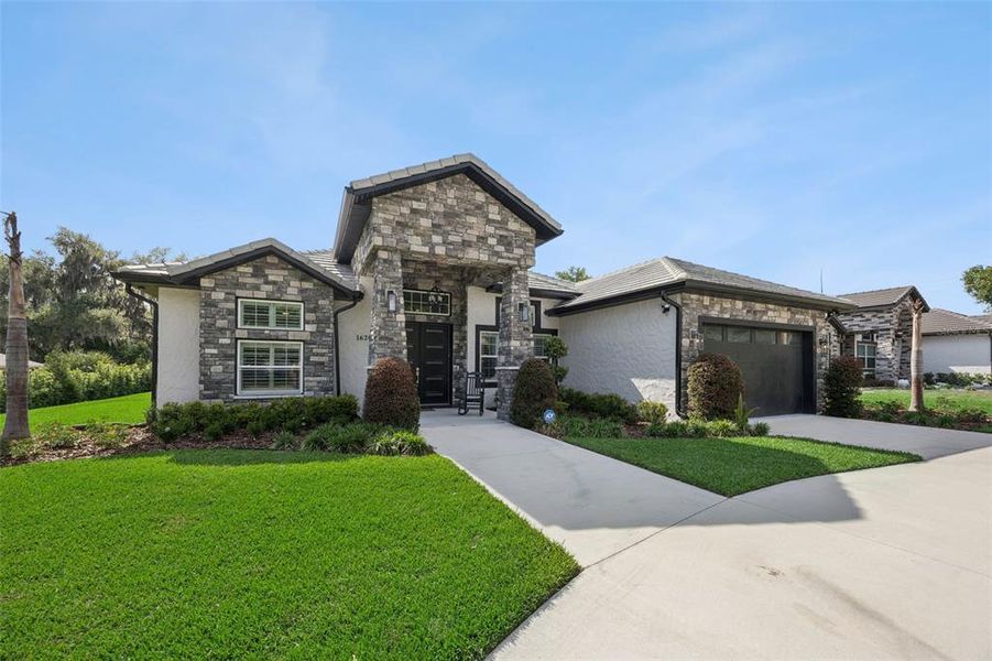 Front exterior of a new home in , Clermont, FL, highlighting curb appeal (Image 21).