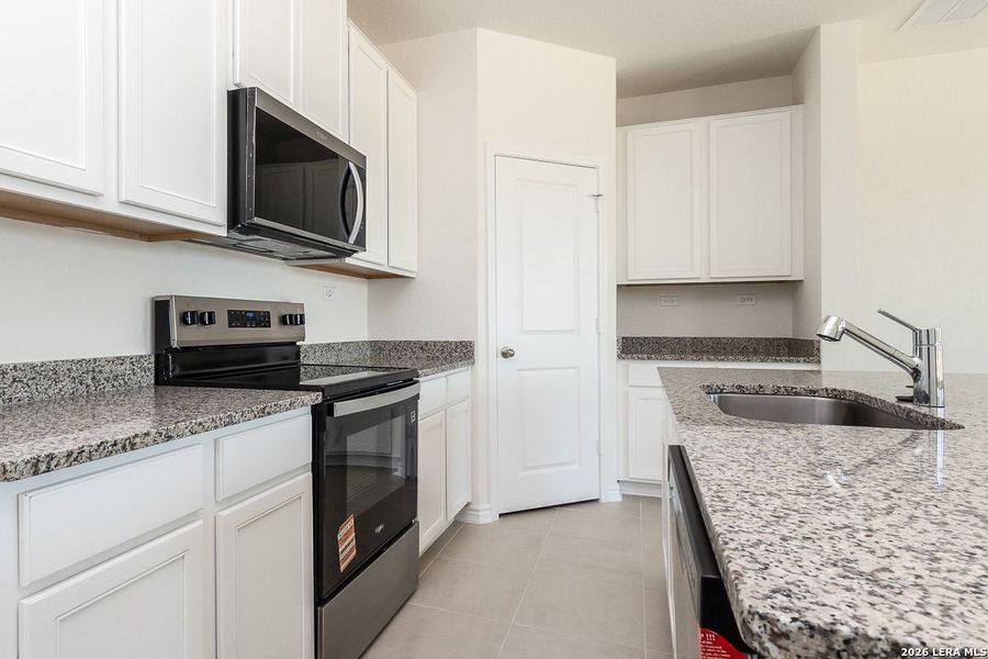 Furnished interior view inside a new home in Woodside Farms, Seguin (Image 3).