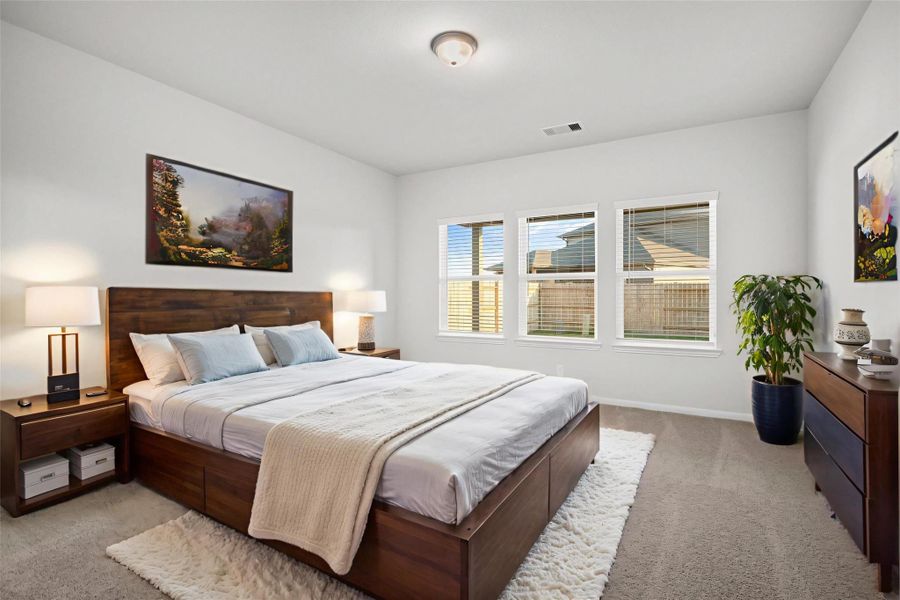 This virtually staged primary bedroom radiates comfort and serenity, featuring ample natural light, plush carpet, and space for large furnishings. It’s a peaceful retreat where you can unwind and enjoy privacy after a long day. Private and tucked away for privacy! This virtually staged primary bedroom radiates comfort and serenity, featuring ample natural light, plush carpet, and space for large furnishings. It’s a peaceful retreat where you can unwind and enjoy privacy after a long day. Private and tucked away for privacy!