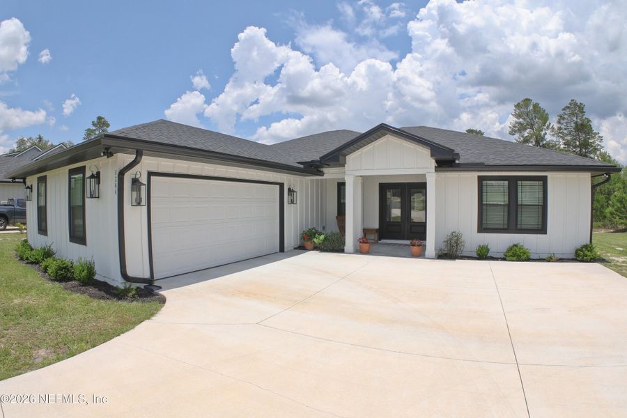 Front exterior of a new home in , Keystone Heights, FL, highlighting curb appeal (Image 26). Front exterior of a new home in , Keystone Heights, FL, highlighting curb appeal (Image 26).