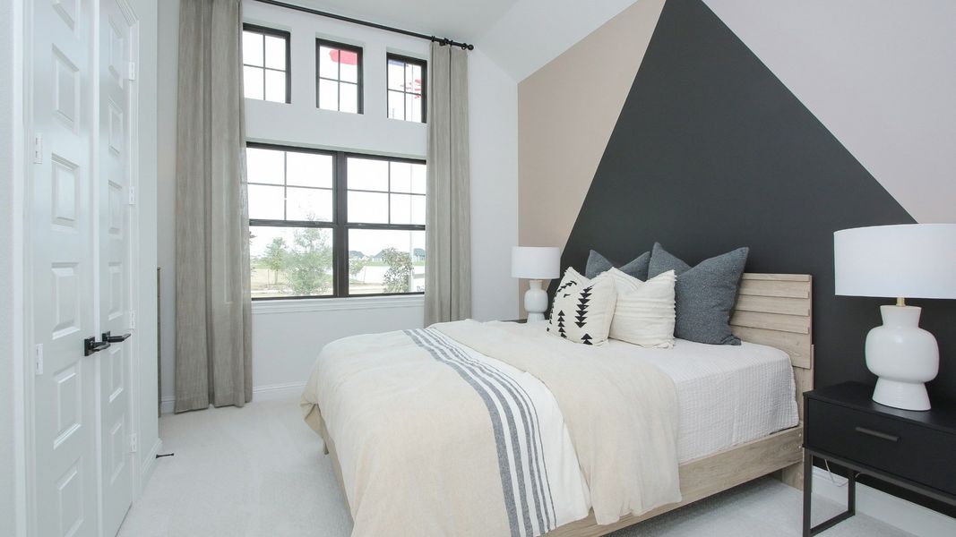 Representative furnished interior of a home built from the Willow by Brightland Homes in Sunterra, Katy (Image 16).