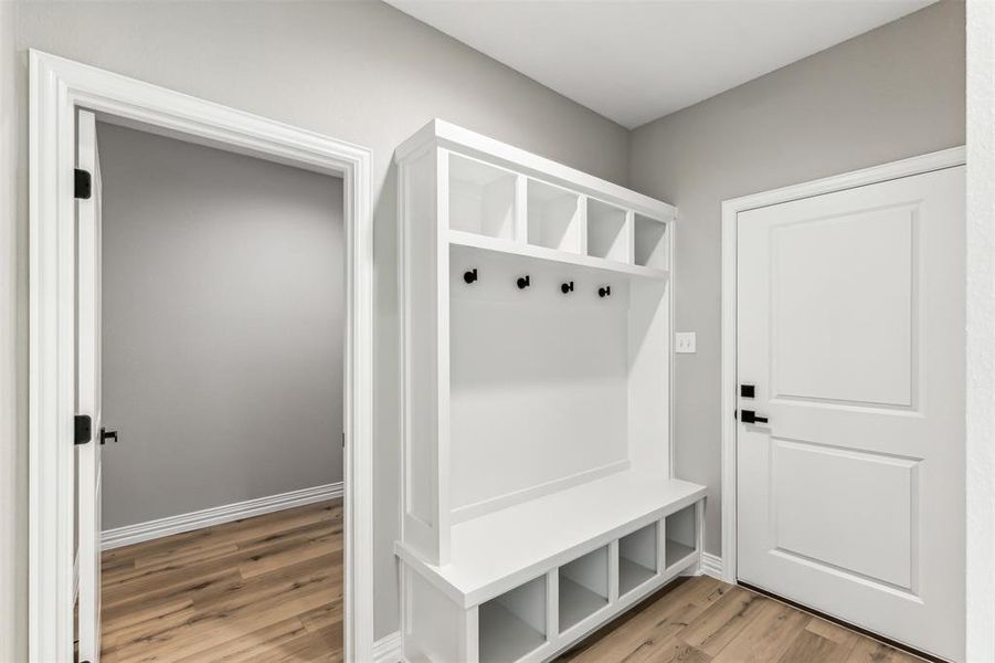 Mudroom featuring light wood-type flooring