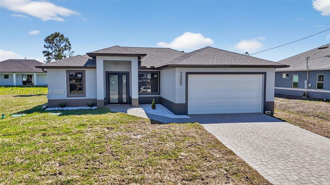 Front exterior of a new home in , Lehigh Acres, FL, highlighting curb appeal (Image 25).