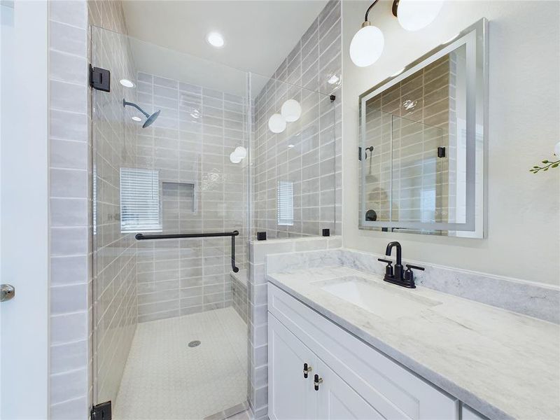 Primary bathroom with Double sinks, soaking tub and steam shower