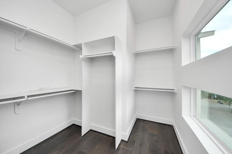Oversized walk-in closet in primary suite