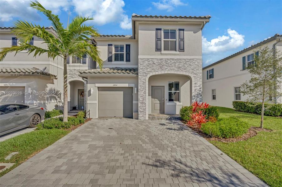 Front exterior of a new home in , Coral Springs, FL, highlighting curb appeal (Image 26).