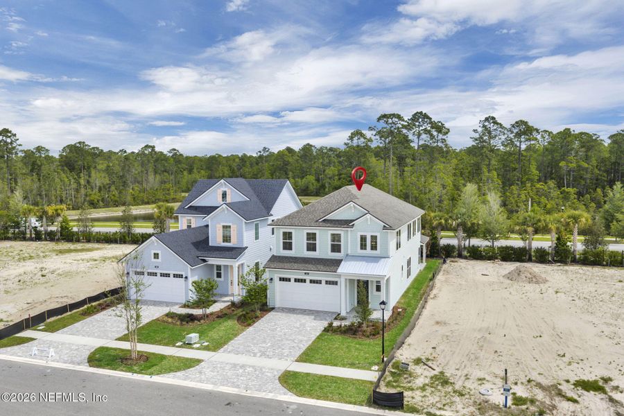 Front exterior of a new home in Seabrook Village at Seabrook, Nocatee, FL, highlighting curb appeal (Image 24).