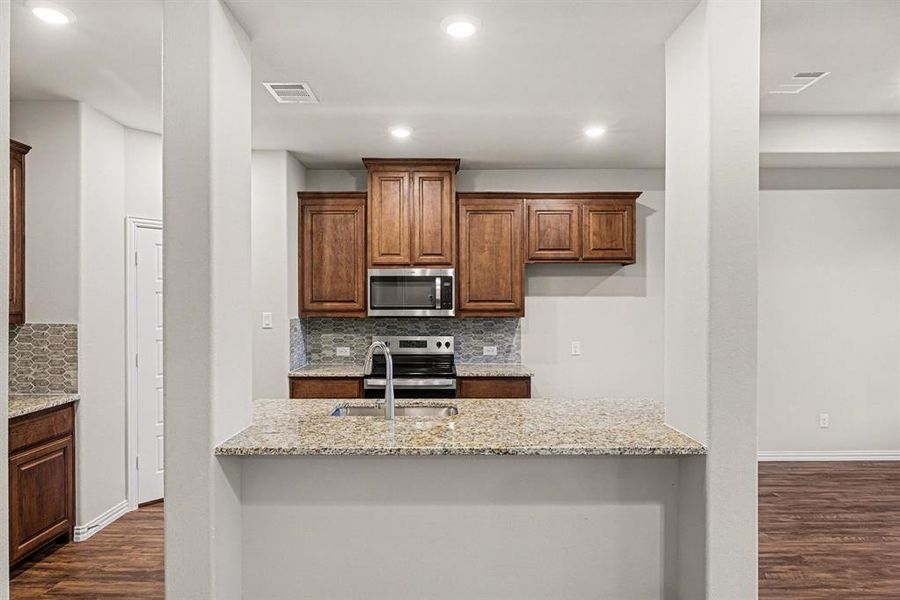 Furnished interior view inside a new home in Courts Of Bonnie Brae, Denton (Image 9).
