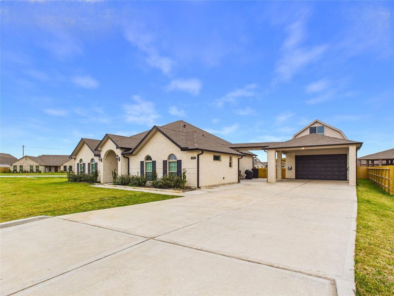 Front exterior of a new home in Pedregal, Galveston, TX, highlighting curb appeal (Image 21).