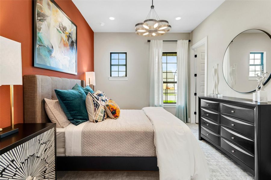 Bedroom with a chandelier and recessed lighting Bedroom with a chandelier and recessed lighting