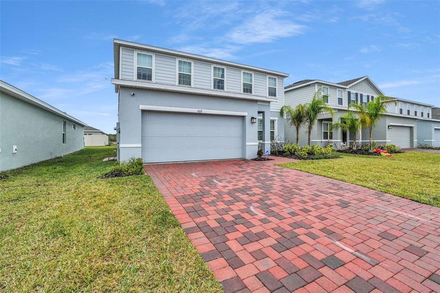 Front exterior of a new home in , St. Cloud, FL, highlighting curb appeal (Image 2). Front exterior of a new home in , St. Cloud, FL, highlighting curb appeal (Image 2).