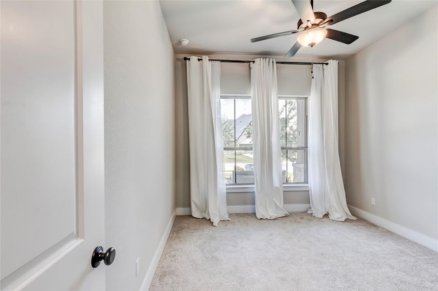 Well-lit room features soft carpeting and generous window light, perfect for relaxation.  Privacy at its finest with each bedroom in a corner of the home.