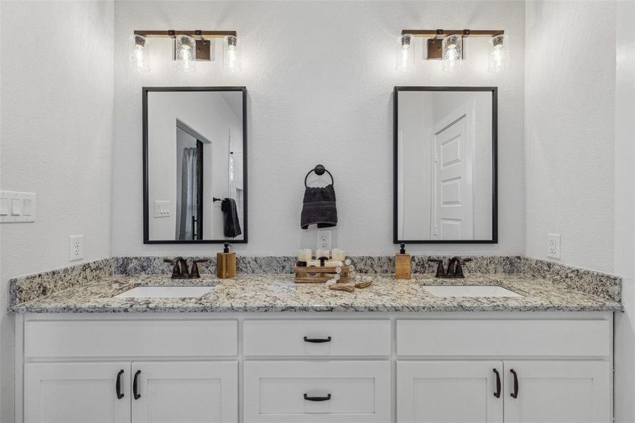 Bathroom featuring dual vanity