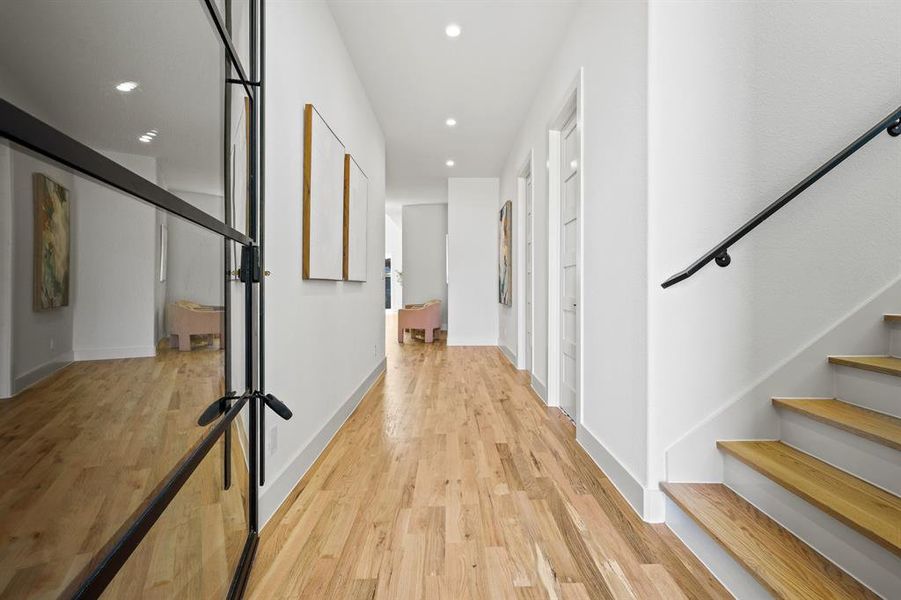 Hall featuring light wood-type flooring