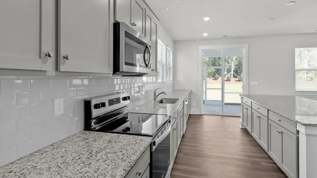 Furnished interior view inside a new home in The Highlands at Cedar Hill Landing, Navassa (Image 7).